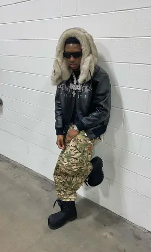 Rob49 wearing Balenciaga boots