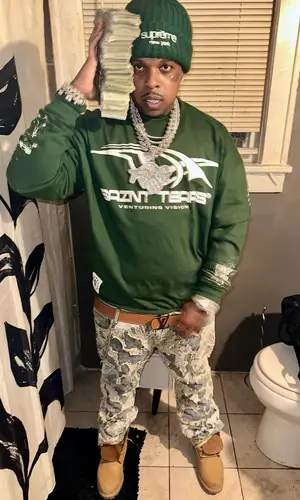 Finesse2tymes’ Outfit in Timberland Boots, Louis Vuitton Belt & Supreme Hat (2025)
