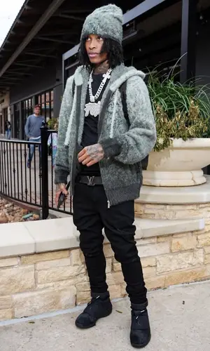 Lil Perfect’s Outfit in Jordan Sneakers, Louis Vuitton Belt & Derschutze Hat (2025)
