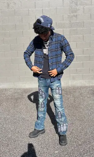 Nardo Wick wearing Louis Vuitton boots