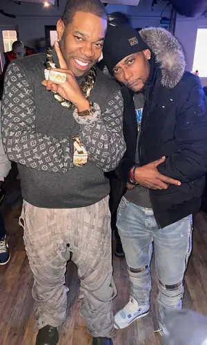 Busta Rhymes’ Outfit in Who Decides War Jacket, Louis Vuitton Sweater & Prada Boots (2025)
