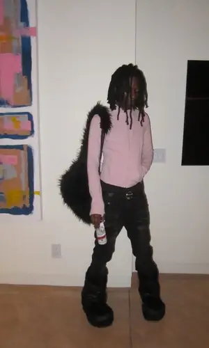 Skaiwater wearing Balenciaga boots