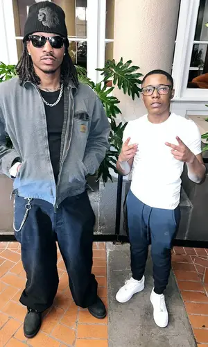 Duke Dennis wearing Louis Vuitton boots