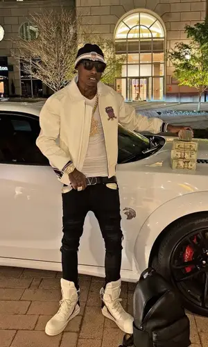 Zillionaire Doe wearing Valentino belt