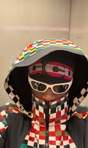 ASAP Nast’s Outfit in Louis Vuitton Jacket, Prada Eyewear & Comme Des Garcons Hat (2025)