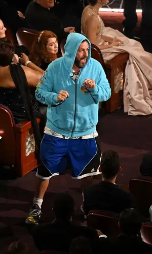 Adam Sandler wearing Under Armour sneakers