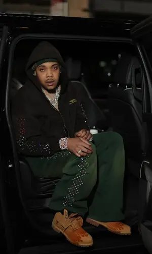 G Herbo wearing Louis Vuitton bag