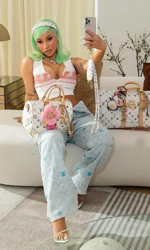 Cardi B’s Outfit in Vale Forever Top, Louis Vuitton Pants & Takashi Murakami Bag (2025)