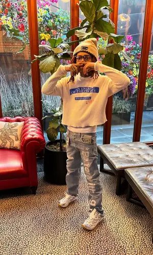 Chuckyy wearing Thug Club swimwear