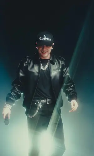 Peso Pluma’s Outfit in Complexcon Jacket, Cartier Watch & Playboi Carti Merch (2025)