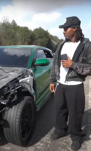Duke Dennis wearing Louis Vuitton boots