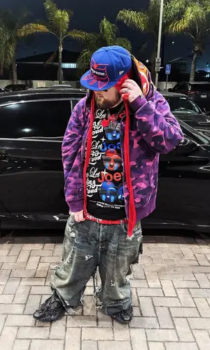 Joeyy wearing Supreme cap