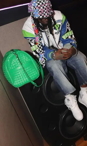 Playboi Carti wearing Adidas sneakers