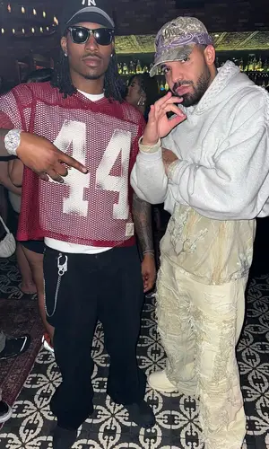 Duke Dennis wearing Louis Vuitton boots