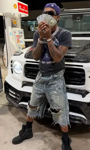 Rich The Kid wearing Balenciaga shorts