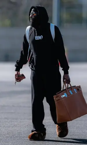 James Harden’s Outfit in Louis Vuitton Boots, Balenciaga Eyewear & Goyard Wallet (2025)