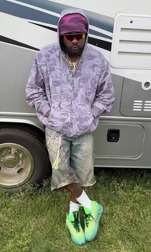 Wale wearing Acne Studios shorts