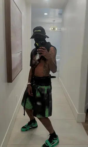Travis Scott wearing Nike scarf