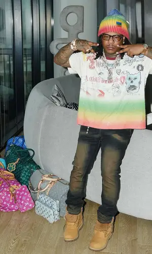 Rylo Rodriguez wearing Louis Vuitton bag