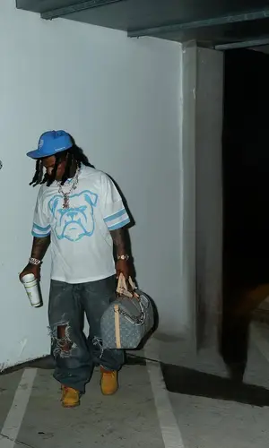 Rylo Rodriguez wearing Louis Vuitton bag