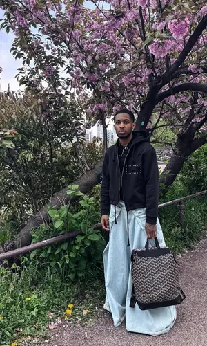 DDG wearing Goyard backpack