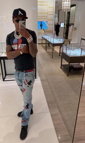 Rich The Kid wearing Cartier watch