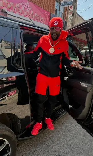 Popcaan’s Outfit in Nike Jacket & Super Mario Merch Hat (2025)