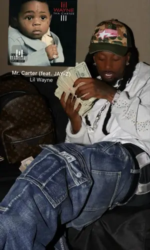 Playboi Carti wearing Louis Vuitton backpack