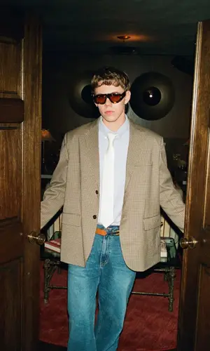 The Kid Laroi’s Outfit in Ralph Lauren Jacket, Louis Vuitton Bag & Bottega Veneta Eyewear (2025)