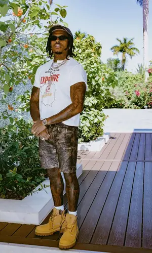 Gunna’s Outfit in Patek Philippe Watch, Prada Eyewear & Acne Studios Cap (2025)