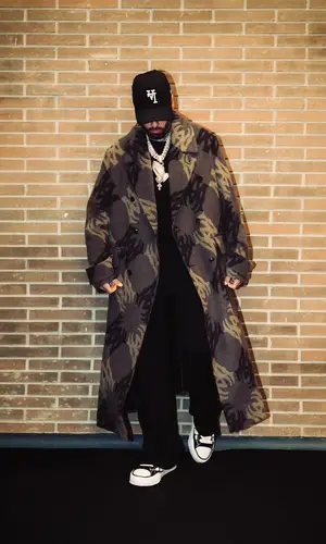 Nicky Jam’s Outfit in Amiri Jacket, Maison Mihara Yasuhiro Sneakers & New Era Hat (2025)