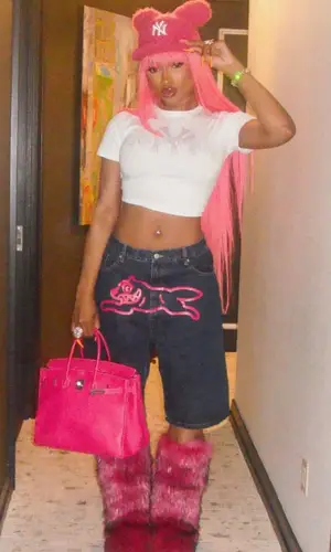 Megan Thee Stallion wearing Youth Is War t-shirt
