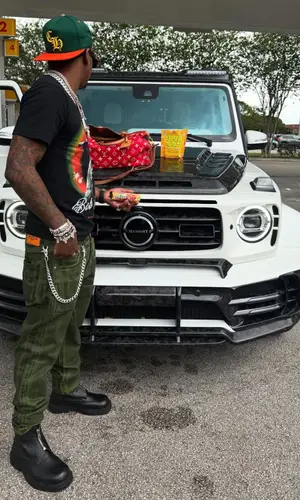 Rich The Kid wearing Louis Vuitton bag