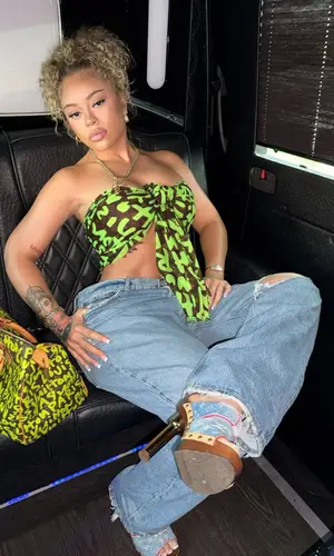 Latto wearing Louis Vuitton scarf