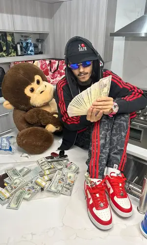 BabyTron’s Outfit in Adidas Hoodie, Cartier Eyewear & Bape Cap (2025)