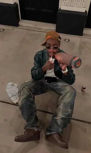 Lil Tjay’s Outfit in Loewe Jacket, Louis Vuitton Belt & Richard Mille Watch (2025)