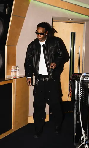 Wiz Khalifa wearing Louis Vuitton bag