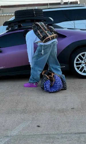Travis Scott wearing Louis Vuitton bag