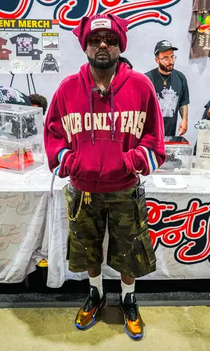 Wale wearing Bape belt