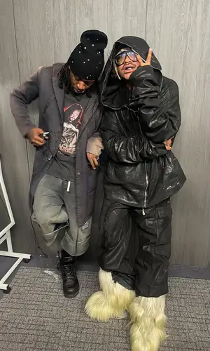 Lil Tracy’s Outfit in Rick Owens Hoodie, Moncler Boots & Tom Ford Eyewear (2025)