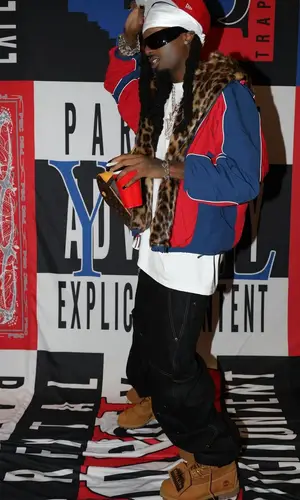 Playboi Carti wearing Louis Vuitton backpack