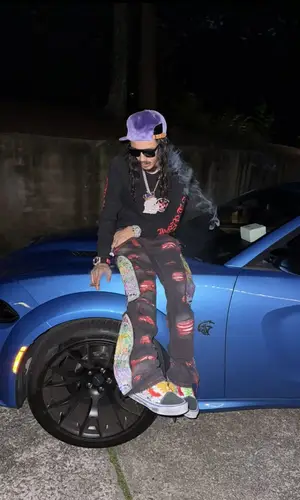 BabyTron’s Outfit in Chrome Hearts Top, Who Decides War Jeans & Louis Vuitton Hat (2025)