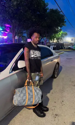 Sauce Walka’s Outfit in Supreme Top, Rick Owens Sneakers & Louis Vuitton Scarf (2025)