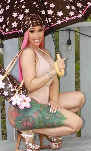 Cardi B’s Outfit in Takashi Murakami Scarf, Louis Vuitton & Skims Underwear (2025)