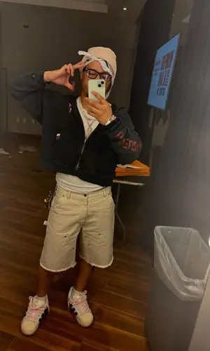 Veeze’s Outfit in Diesel Top, Chanel Hat & Louis Vuitton Wallet (2025)