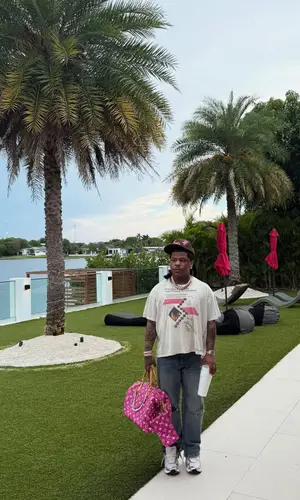 Rylo Rodriguez wearing Louis Vuitton bag