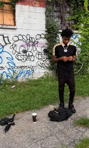 Lazer Dim 700 wearing Gucci shirt