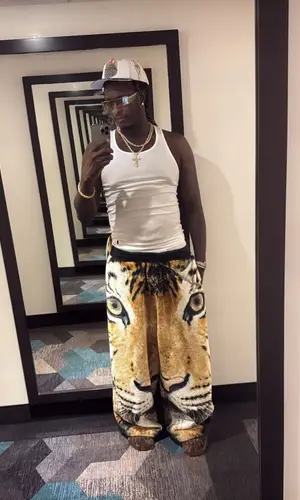 Young Thug wearing Bossi cap