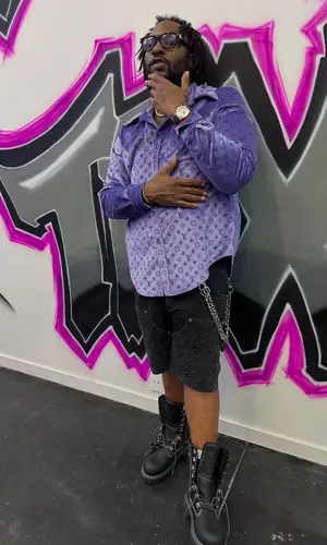 Peezy wearing Louis Vuitton boots