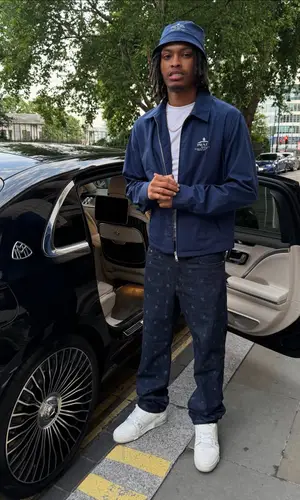 Nemzzz’s Outfit in Louis Vuitton Jeans & Prada Hat (2025)